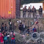 Migrant children along Texas’ floating border barrier bear injuries from razor wire, leaving them bloody Along Texas' floating border barrier