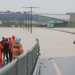 Large-scale rescue operation recovers 7 bodies after flooding traps cars in South Korea tunnel rescue operation recovers 7 bodies after flooding traps cars in South Korea tunnel