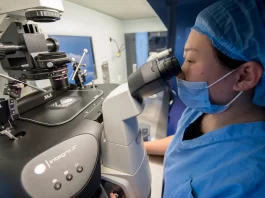 A medical worker performs genetic testing at the Shanxi Province Reproductive Science Institute in Taiyuan