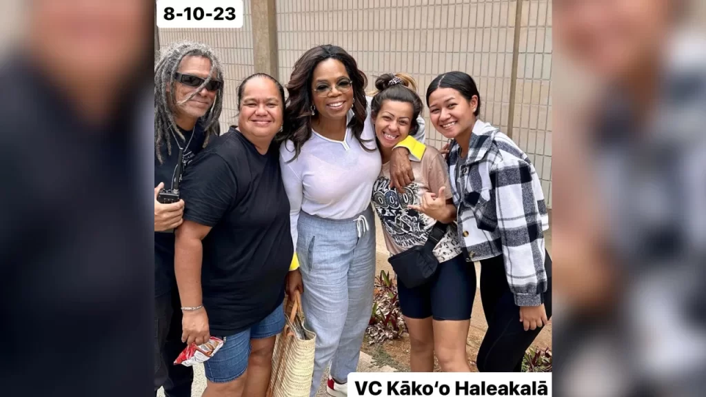 Oprah Winfrey, a part-time Maui resident, poses for a photo at a shelter in Wailuku in this image posted to Instagram