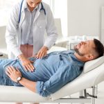 Navigating Digestive Health: How a GI Specialist Can Provide Relief and Expert Care Gastroenterologist,Examining,Man,In,Clinic