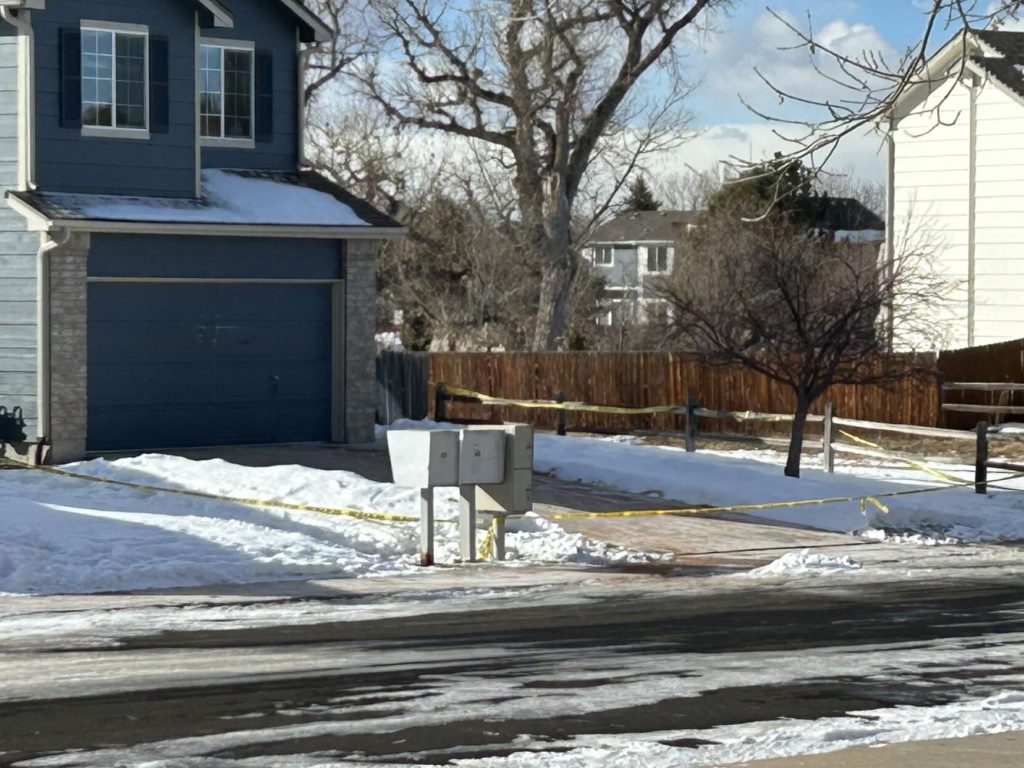 Police tape surrounds the unincorporated Douglas County home near Parker where a woman was found dead Thursday. South Metro Fire Rescue firefighters responded to a gas leak and evacuated neighbors, before it was shut down